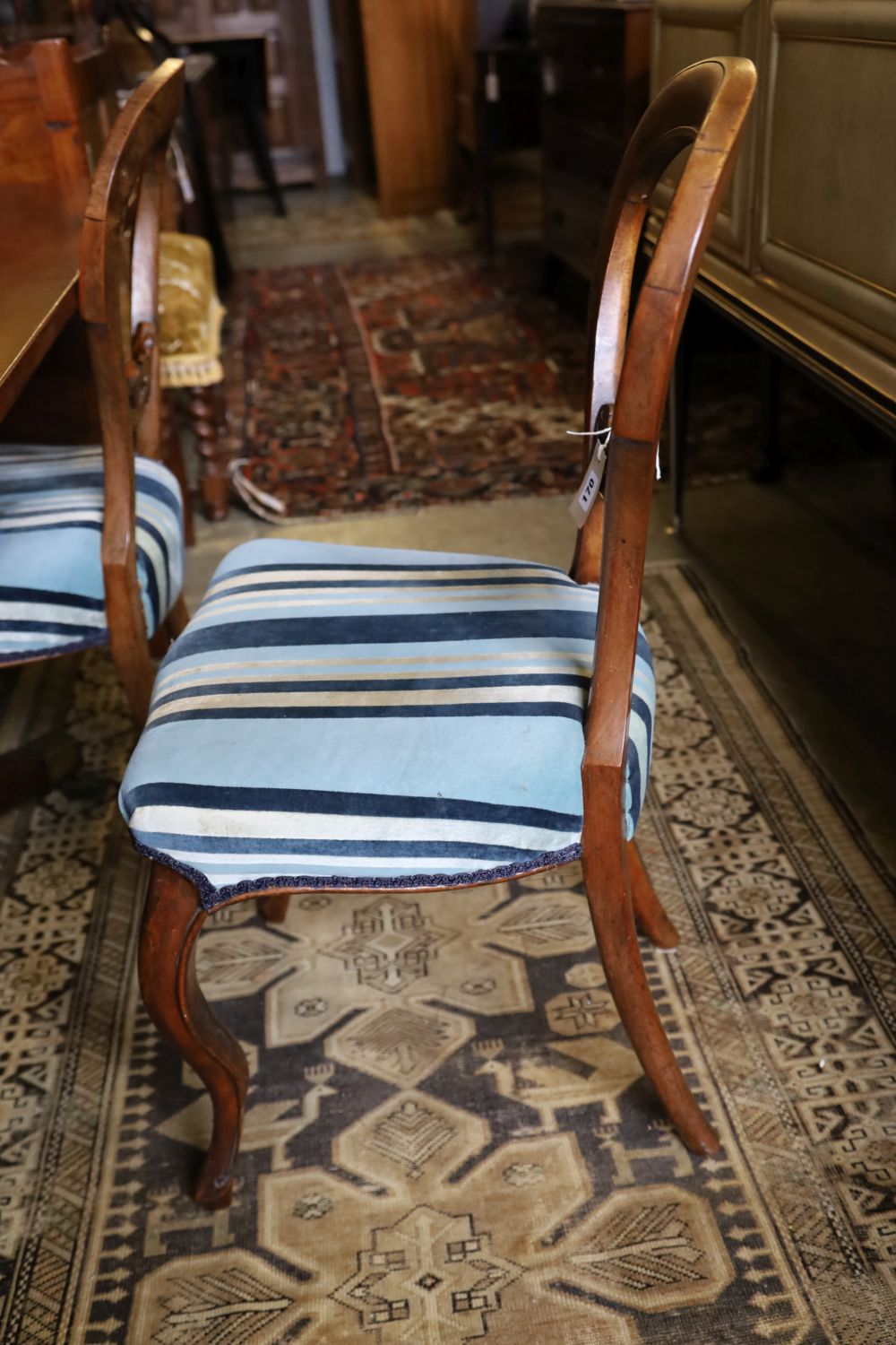 A set of four Victorian walnut balloon-back chairs